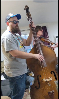 Jake Stargel playing bass, with Christian Ward on fiddle.